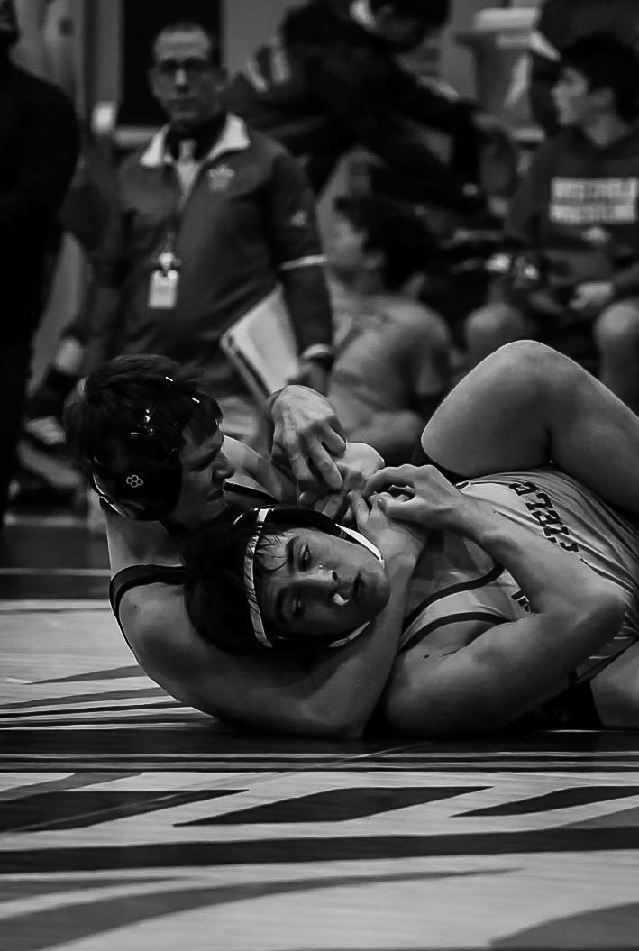 Sophomore Quinn Rose makes a move for a submission against a Westfield wrestler at 165 class. Another exciting Raider - Blue Devil match up.

