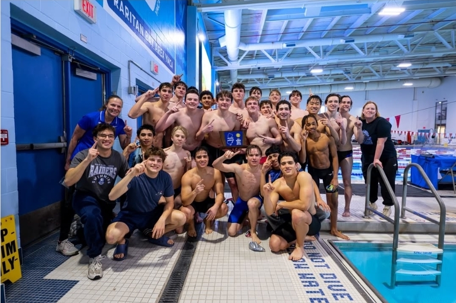 The SPF boys swimming team poses with the sectional championship. The team defeated Ridge in the finals.