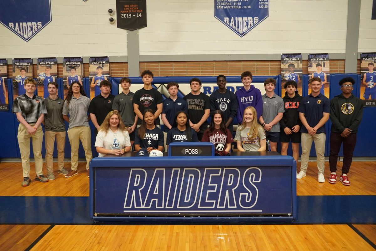 SPF student-athletes stand in the new gym on signing day. Signing day took place on Thursday, April 23.