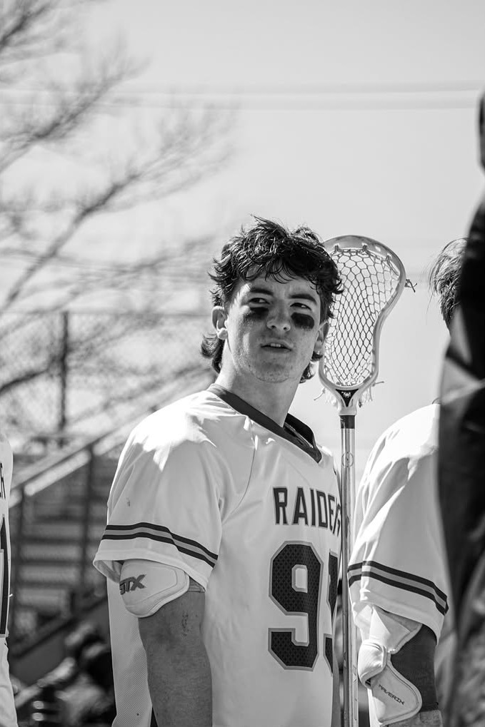 Senior lacrosse player Griffin Hough looks to the side. Hough played lacrosse all four years of high school.