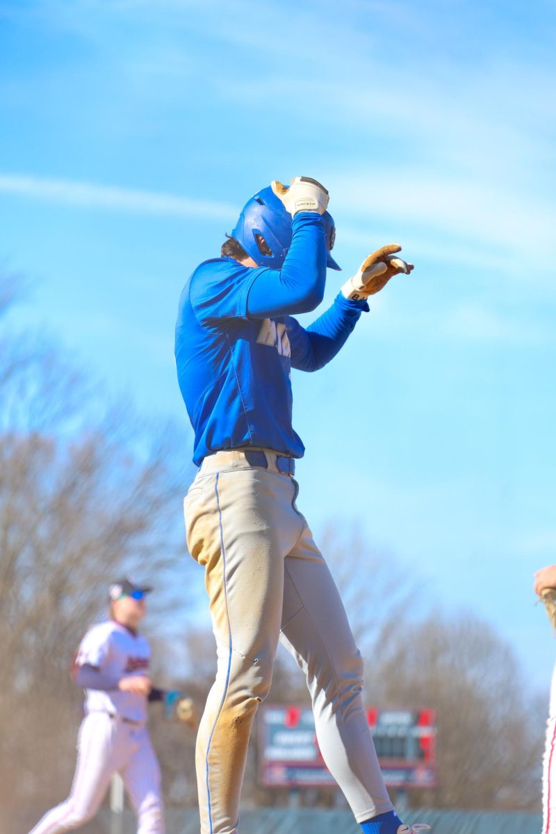 Junior Aiden Luccarelli adjusting his helmet after taking 3rd successfully against governor Livingston baseball. The Raiders have a promising season on their hands.