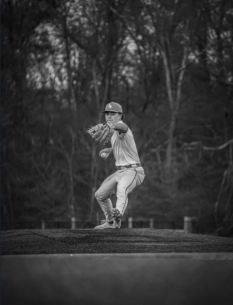 Number 5, Senior FDU commit Alex Bolton throws a pitch in a game against cancer under the lights at Snyder Avenue Park. Raiders baseball successfully defeated Westfield in a game to be remembered.