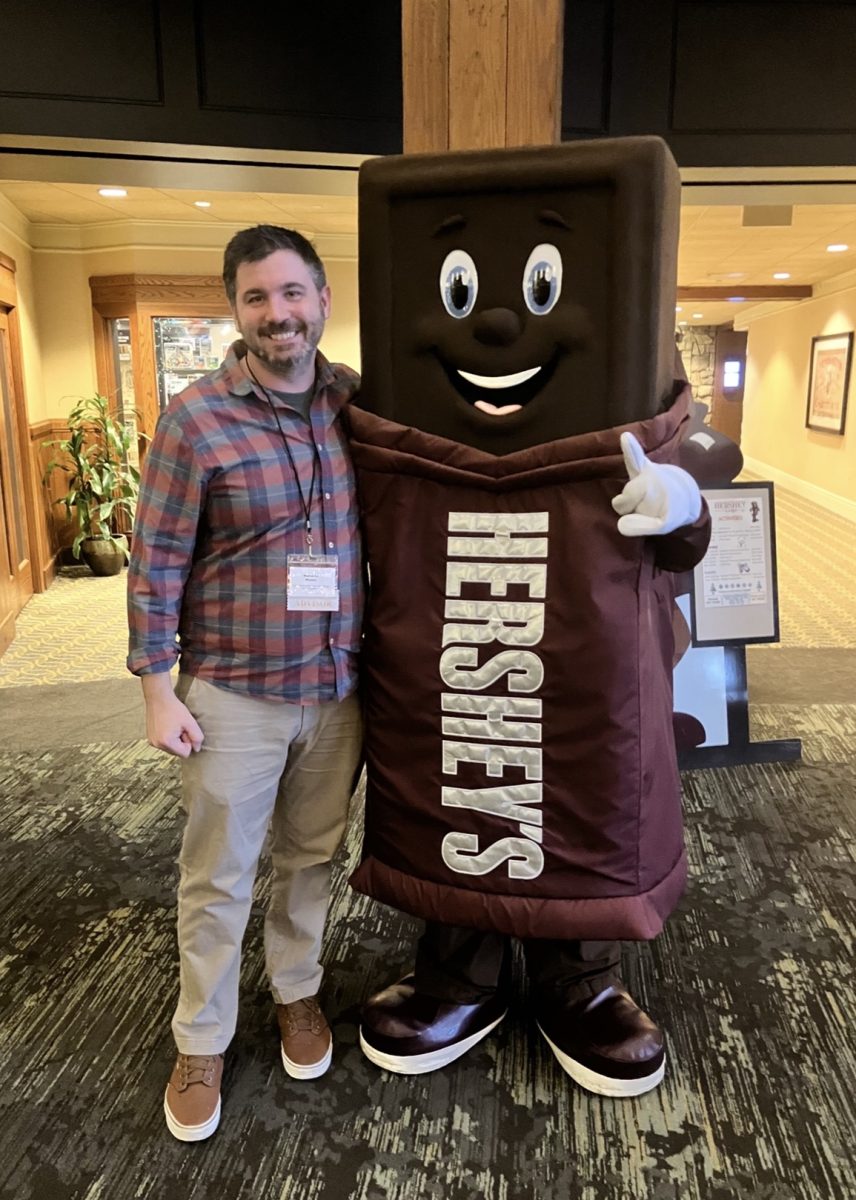 Mr. Moskal poses next to the Hershey mascot in Hershey, PA. He was one of the staff helping out during the last Model UN trip. 
